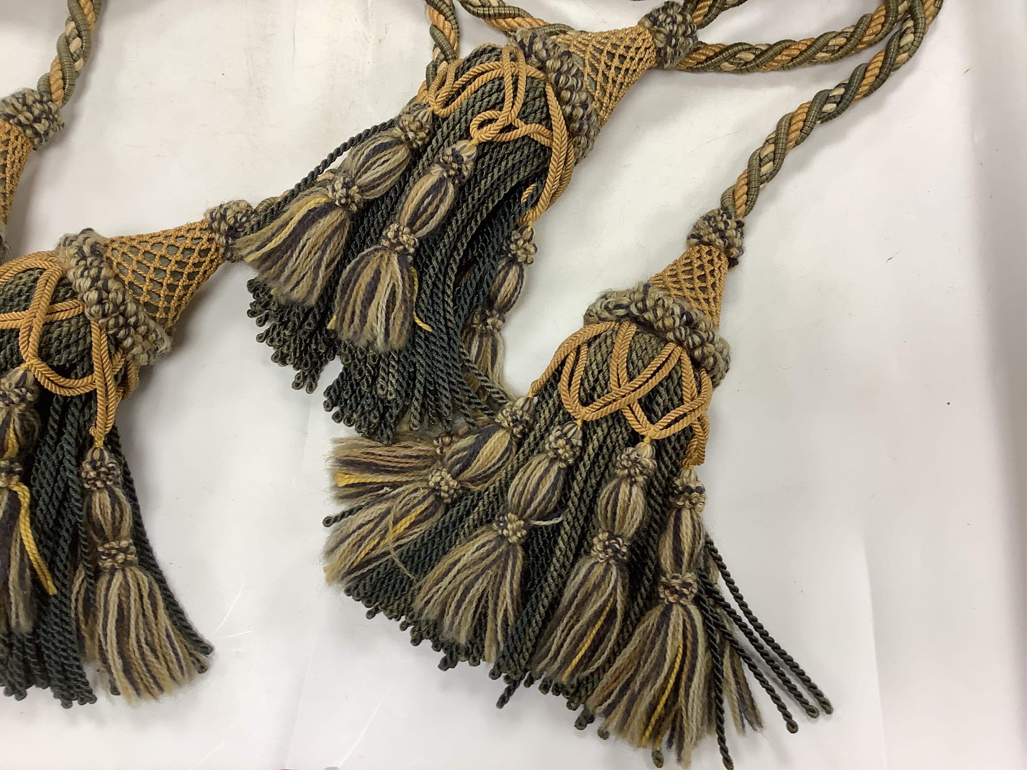 Two 20th century long corded, double tasselled silk and wool tie backs, 194cm each. Condition - some fading.